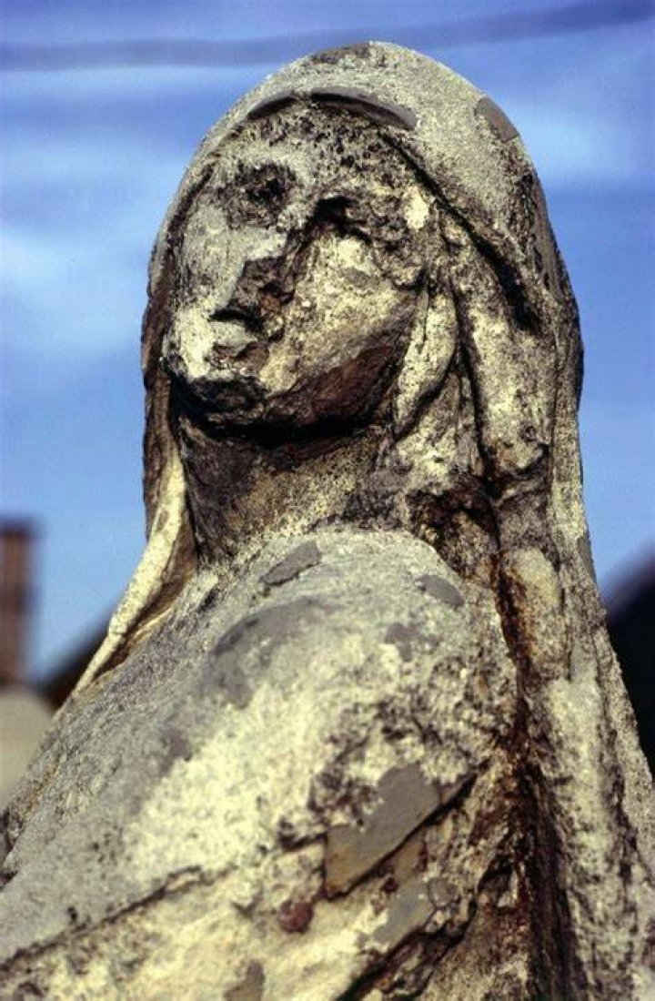 How can we protect statues from acid rain?