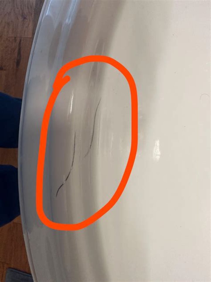 How do you get scratches out of a white cast iron sink?